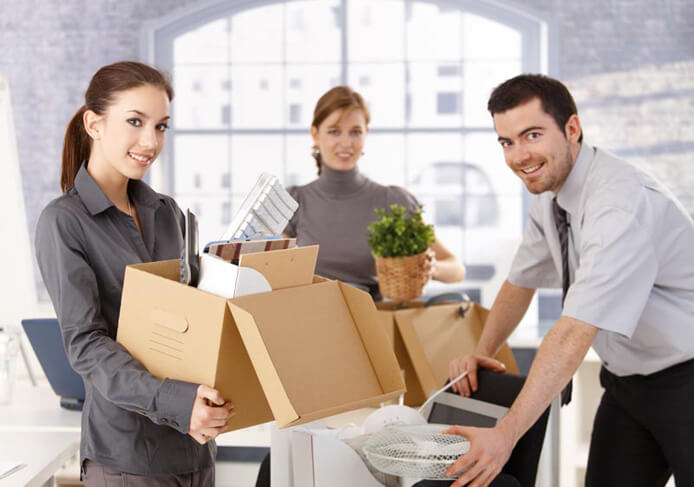 Young office workers moving office